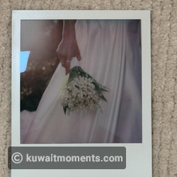 Look at her cute wedding bouquet!